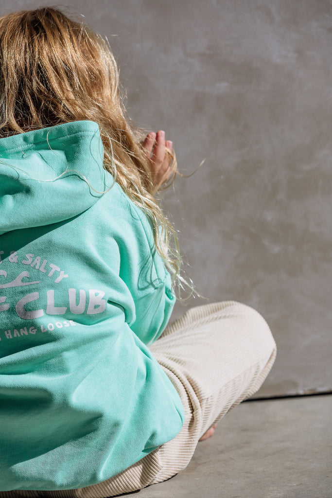 Back view of Barefoot and Salty Surf Club hoodie with logo print